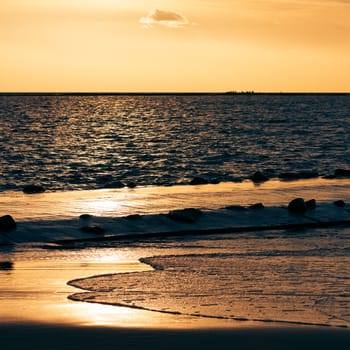 View of golden sunset at Baltic sea shore