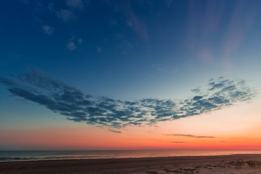 Blue cloudy sky over the Baltic sea at evening