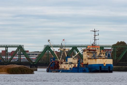 Blue cargo ship in the port of Riga, Europe