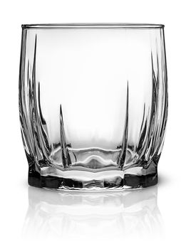 Empty glass for scotch whiskey isolated over white background