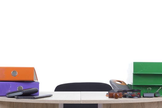 Office table with office supplies on a white background