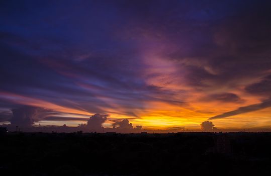 twilight sunset sky and color clouds in city scape