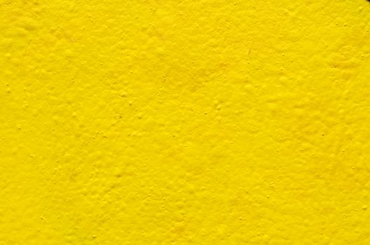 Yellow background image on the cement wall