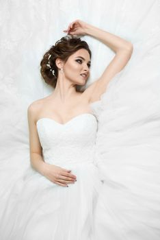 portrait of beautiful young bride in wedding dress 