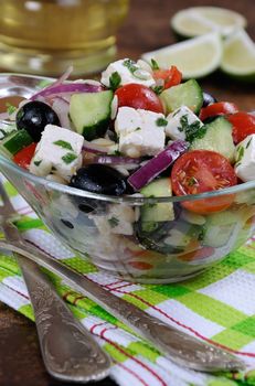 greek salad orzo pasta with black olive, red onion and cucumber, cherry tomatoes, feta and herbs