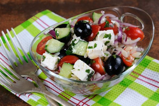 greek salad orzo pasta with black olive, red onion and cucumber, cherry tomatoes, feta and herbs