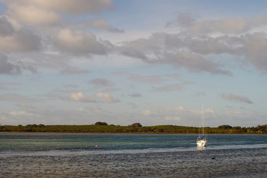 Beautiful sea with a sailboat at the sunny day in summer