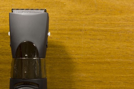 Hair clipper style on the wooden background