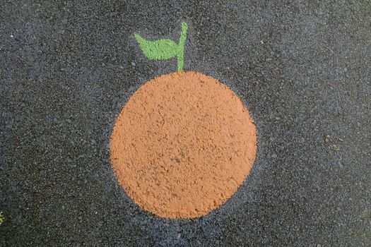 Orange Painting on Asphalt Ground.