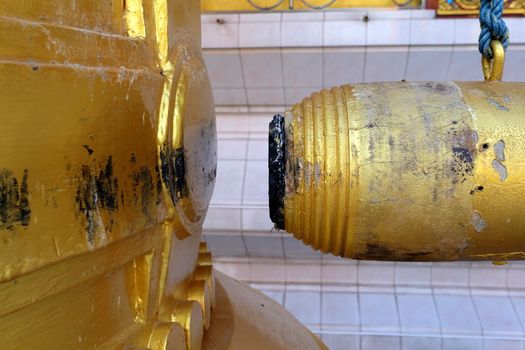 Wood chimes and Golden Bell in Buddhist Temple in Thailand.