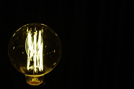 Close up light bulb on the black background