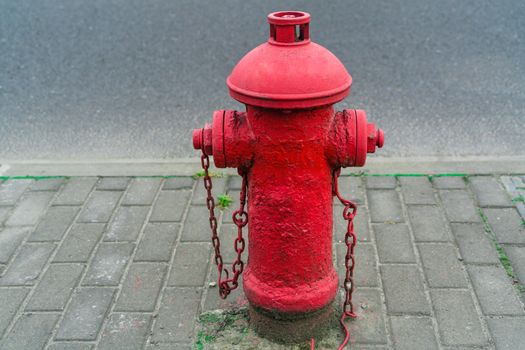 Red fire water hydrant beside the road