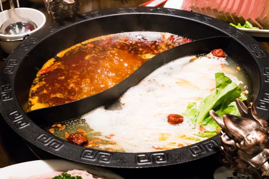 Shabu pot in Chinese style - pork soup and oily spicy soup