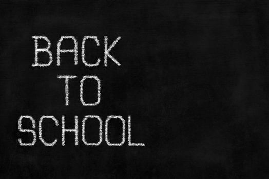 White Chalk Writing "Back To School" on Chalkboard with Right Space.