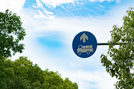 Truck entrance allowed sign on the blue sky and tree