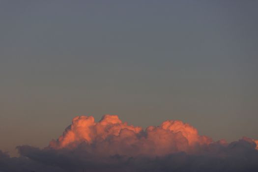 Blue sky with lots of pink clouds. sunset