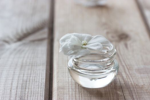 moisturising lotions and white flower, spa treatments