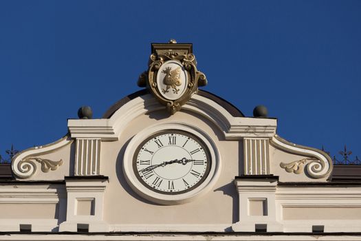 Close up of building with a clock. blue sky