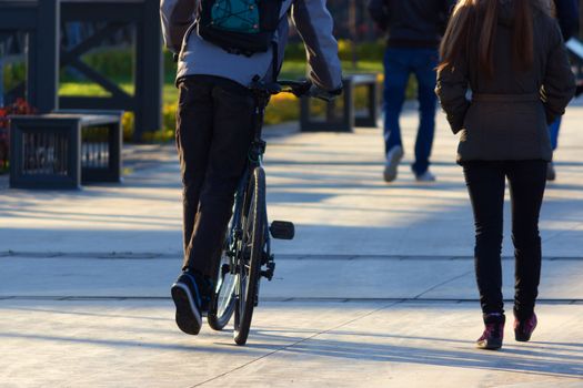 free people having fun with bikes. boy and girl