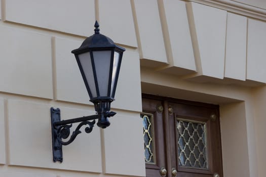 old style lantern on a building wall