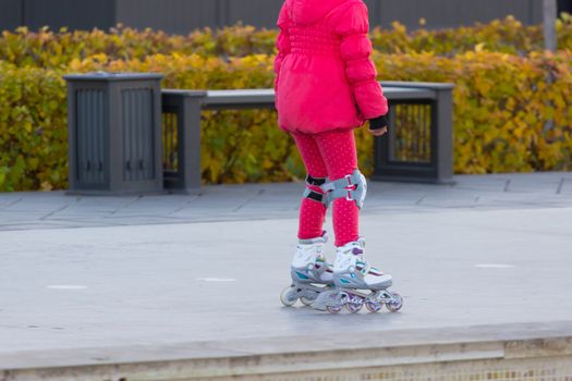 Roller skate legs close up in skatepark. copy space