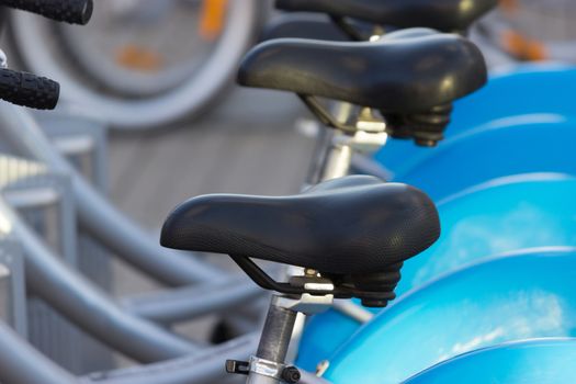 Silver blue bicycle at parking, bike rent