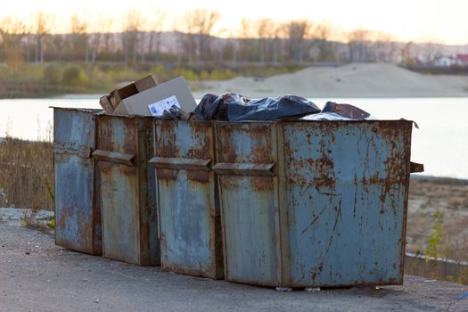 Four old trash cans. rustic and grunge