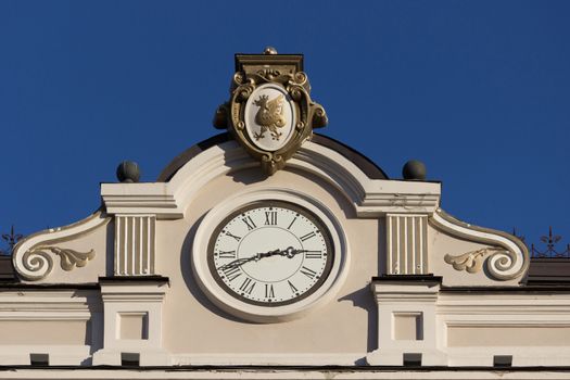 Close up of building with a clock. blue sky