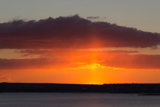 sunrise over the sea and the beach with clear skies