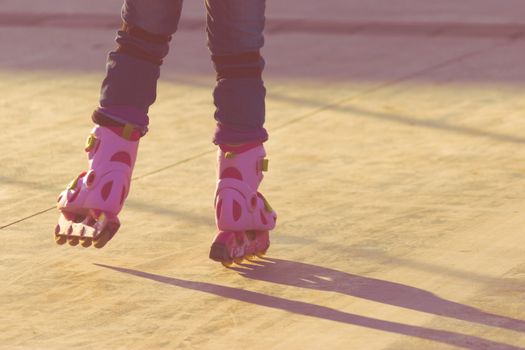 Roller skate legs close up in skatepark. copy space