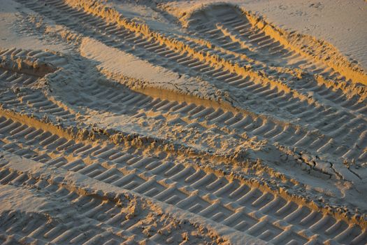 Tracks on the sand. jorney thought the dessert