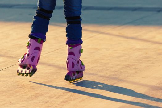 Roller skate legs close up in skatepark. copy space