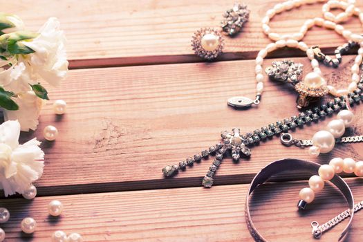 antique vintage silver jewellery on wooden table