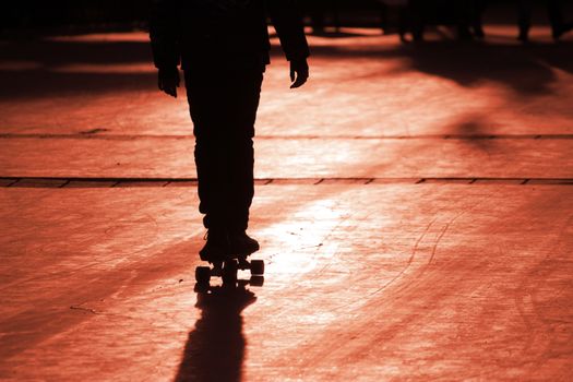 Silhouette of a young skateboarder. scateboard is a risky sport