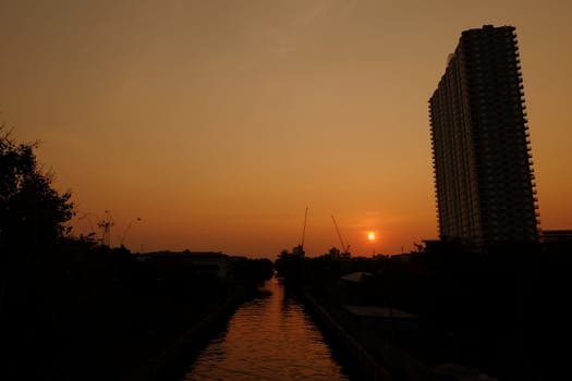 Sunset at Phra Sri Charoen Canal Bangkok, Thailand.