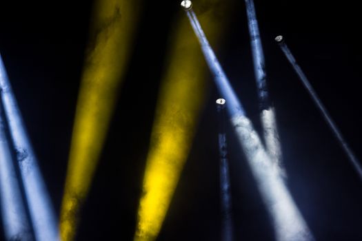 Colorful lights and smoke on a stage.