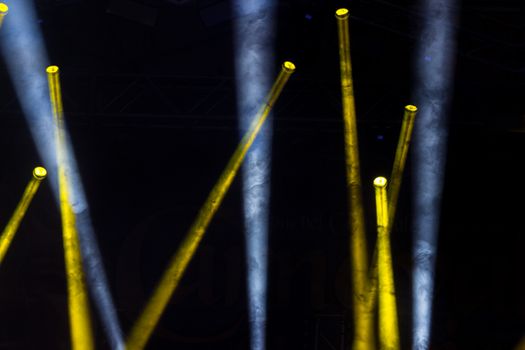 Colorful lights and smoke on a stage.