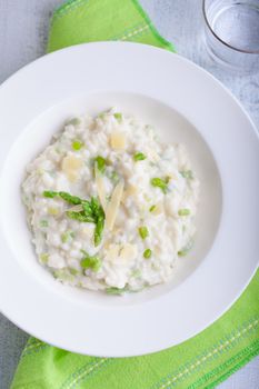 Risotto with Asparagus and cheese served on a table