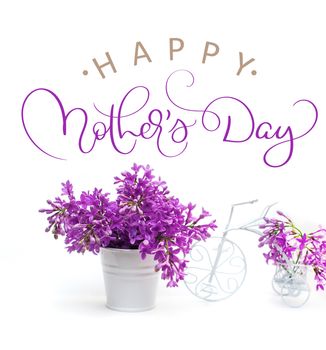 lilac flowers on a white background decorated with small bike and text Happy mothers day. Calligraphy lettering hand draw.