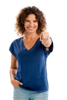 Portrait of a smiling middle aged woman pointing to the camera