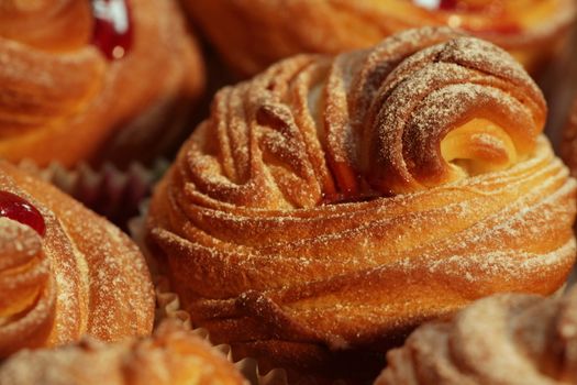 American cruffins with jam, powdered sugar 