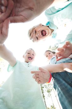 Group of smiling children looking down into camera