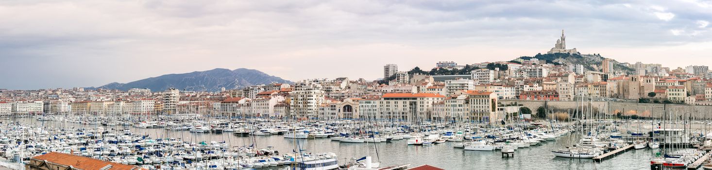 Marseille, France sunset. The famous european harbour view on the Notre Dame de la Garde panorama