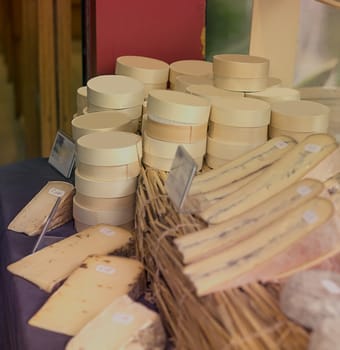 Display of traditional french cheese and camembert in boxes