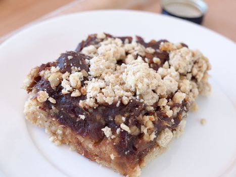 a close up of a crumbly and soft delicious date bakery slice