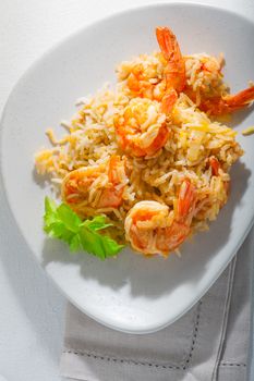 Bowl of fried rice with shrimps on a plate