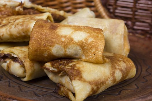 Freshly baked pancakes and wrapped with meat