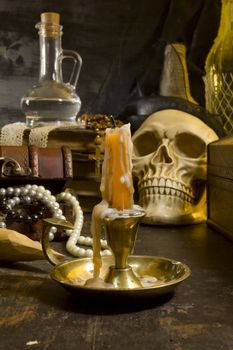 Gothic still life with a skull and a candle