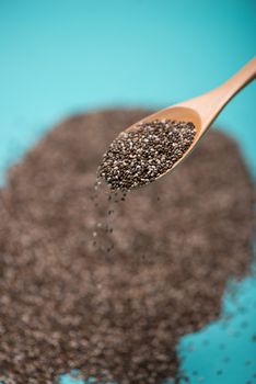 Close-up of ealthy chia seeds in a spoon. Text space.