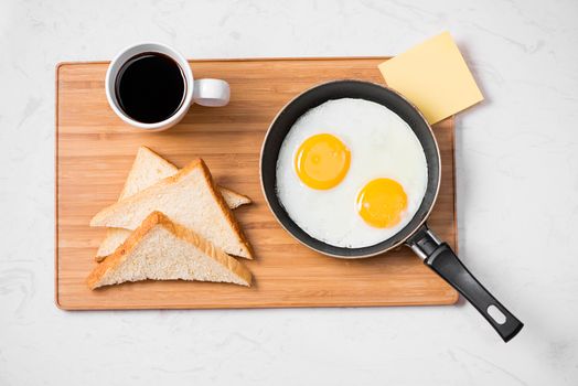 Traditional breakfast with fried eggs on a plate